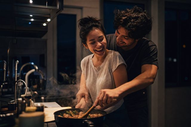A couple cooking together